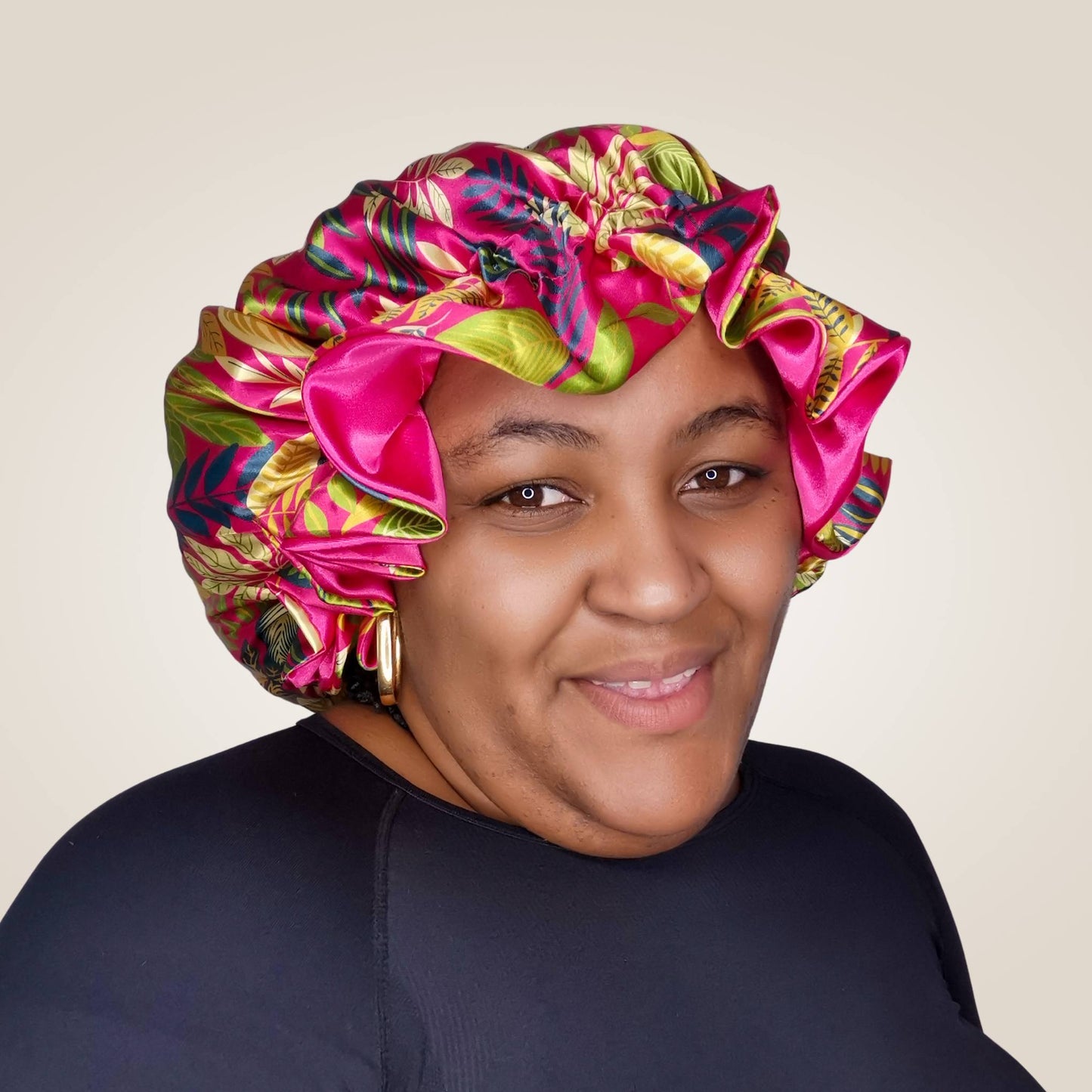 paradise print satin bonnet with leaves and flowers - pink with pink lining model shot