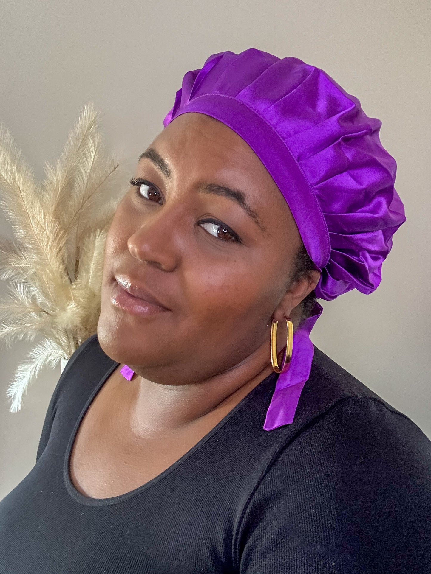 silk bonnet with hair wrap ties - purple colour on black model with natural background