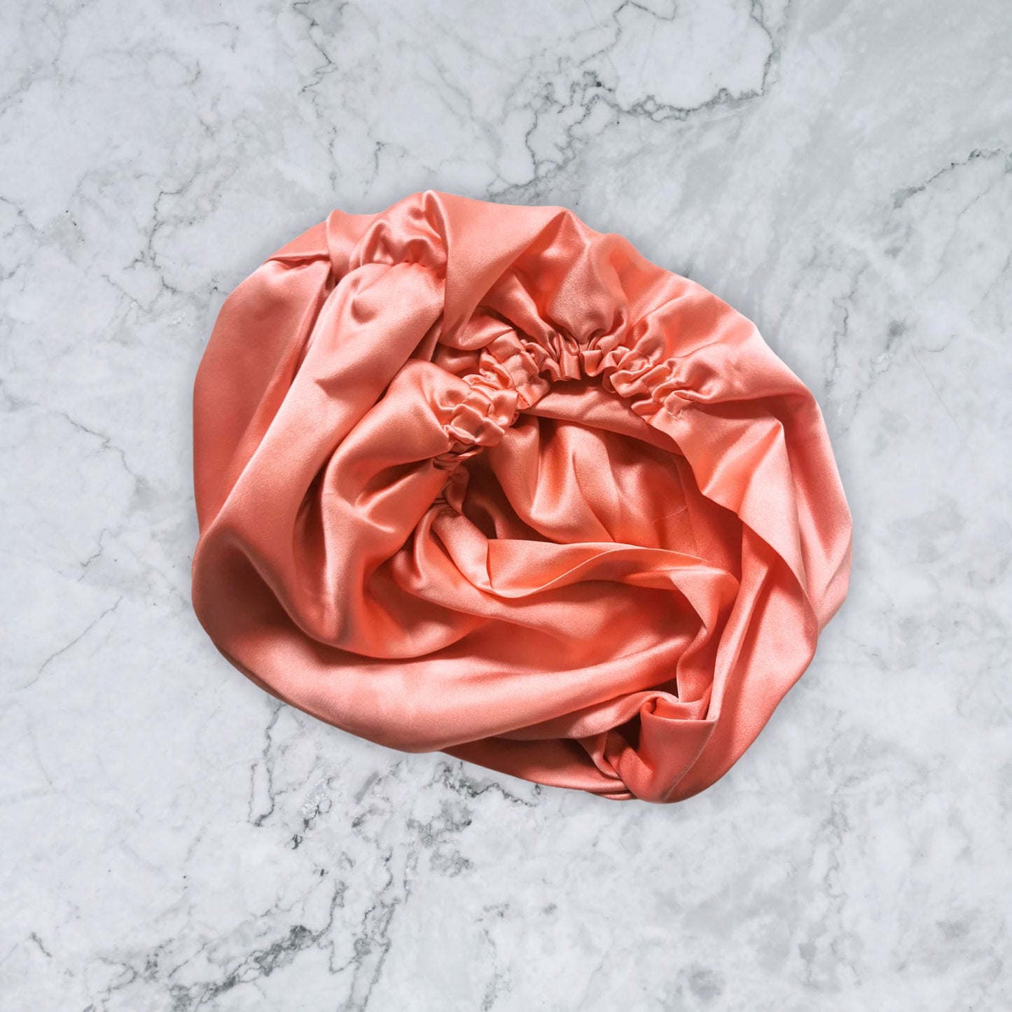 silk_twist_bonnet_coral_orange_pink_rear_view