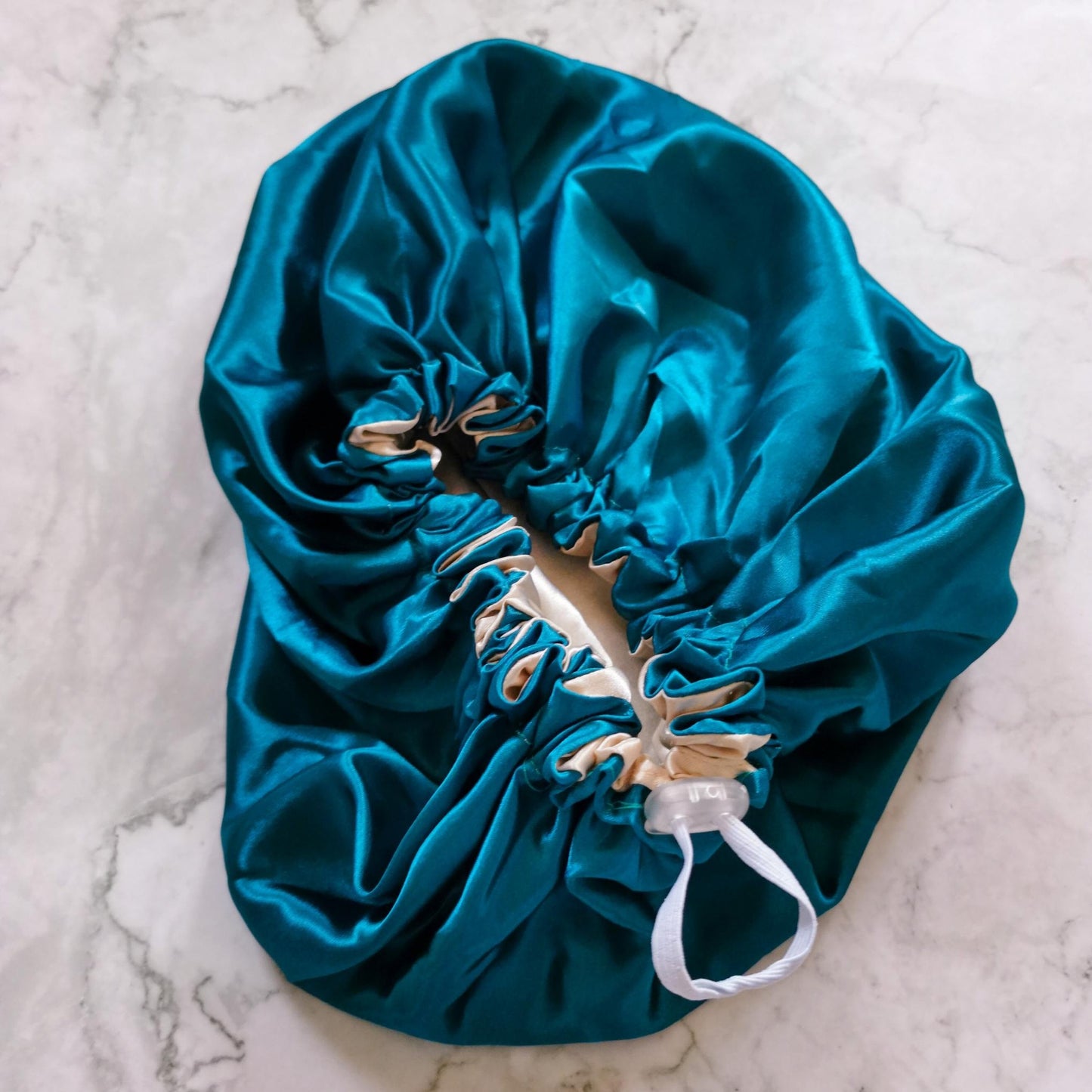 Hair wrap heaven Stays on satin bonnet - teal and nude adjustable elastic toggle view