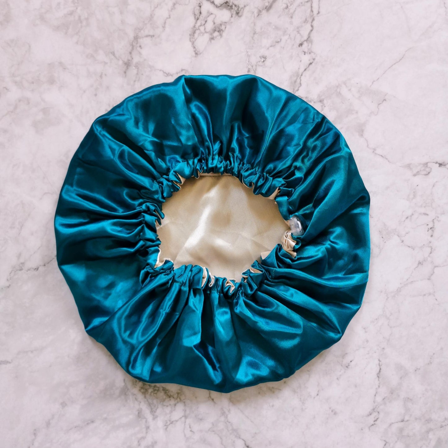 Hair wrap heaven Stays on satin bonnet - teal and nude flat image