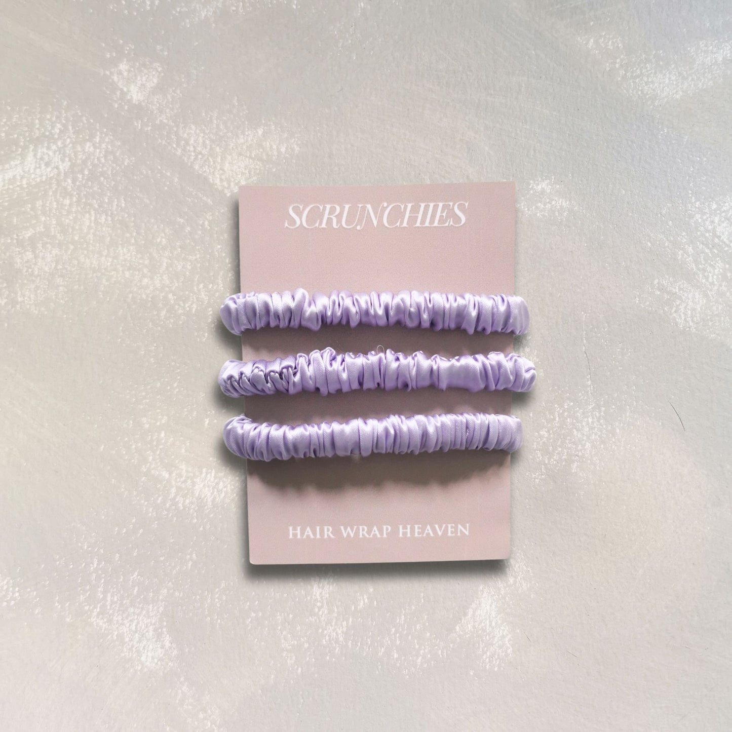 Lilac_skinny_silk_scrunchies_from_Hair_Wrap_Heaven