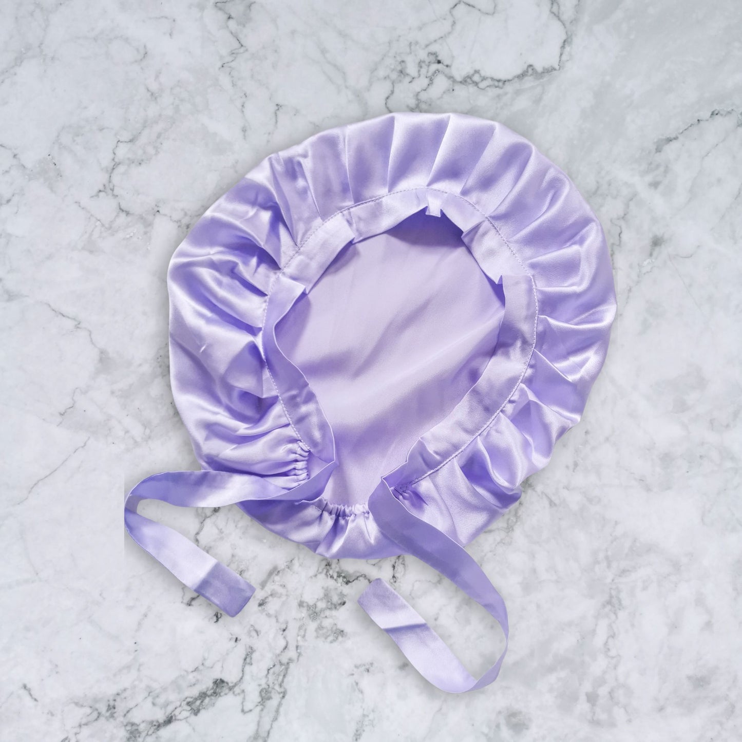 Silk_bonnet_with_ties_lilac_flat_view