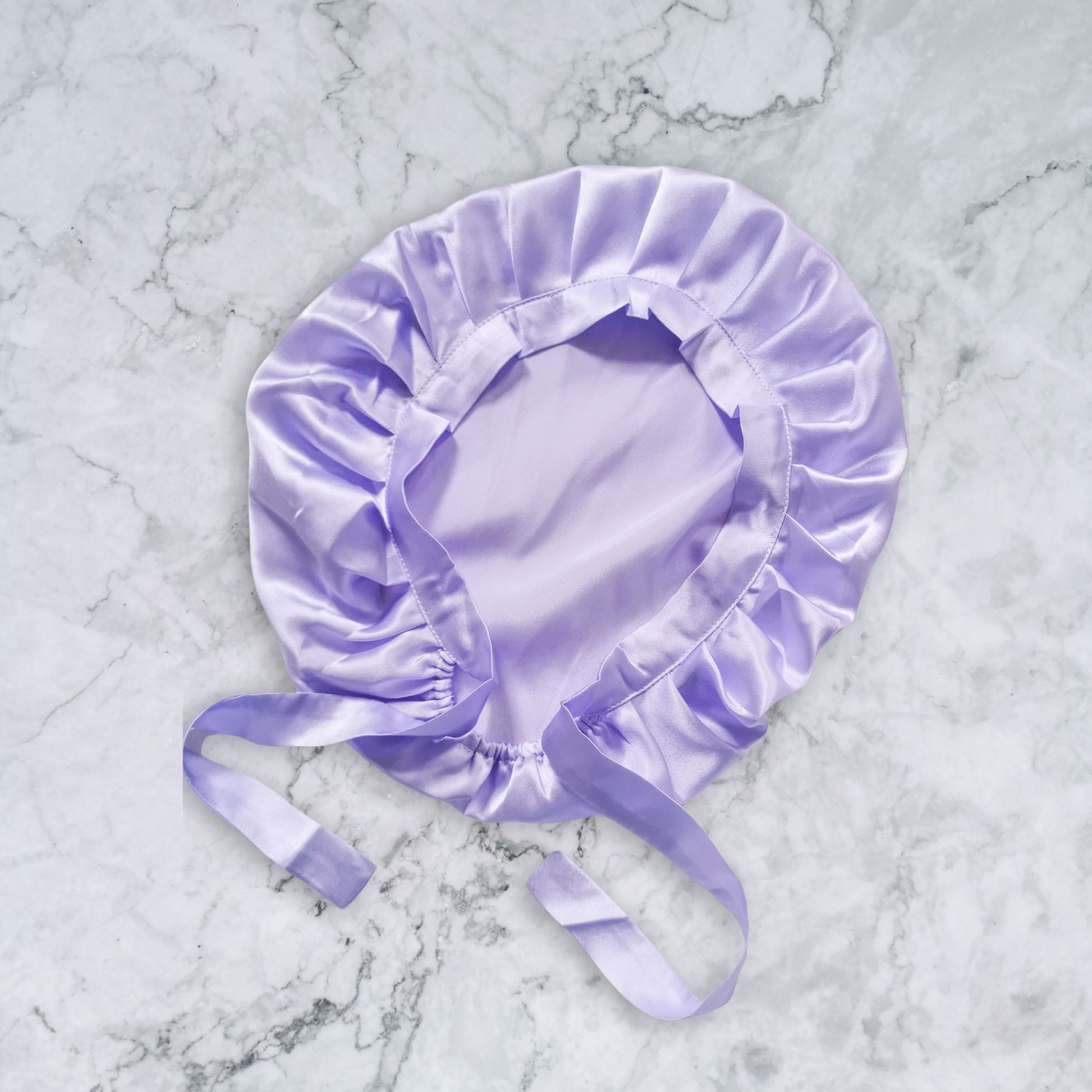 Silk_bonnet_with_ties_lilac_flat_view