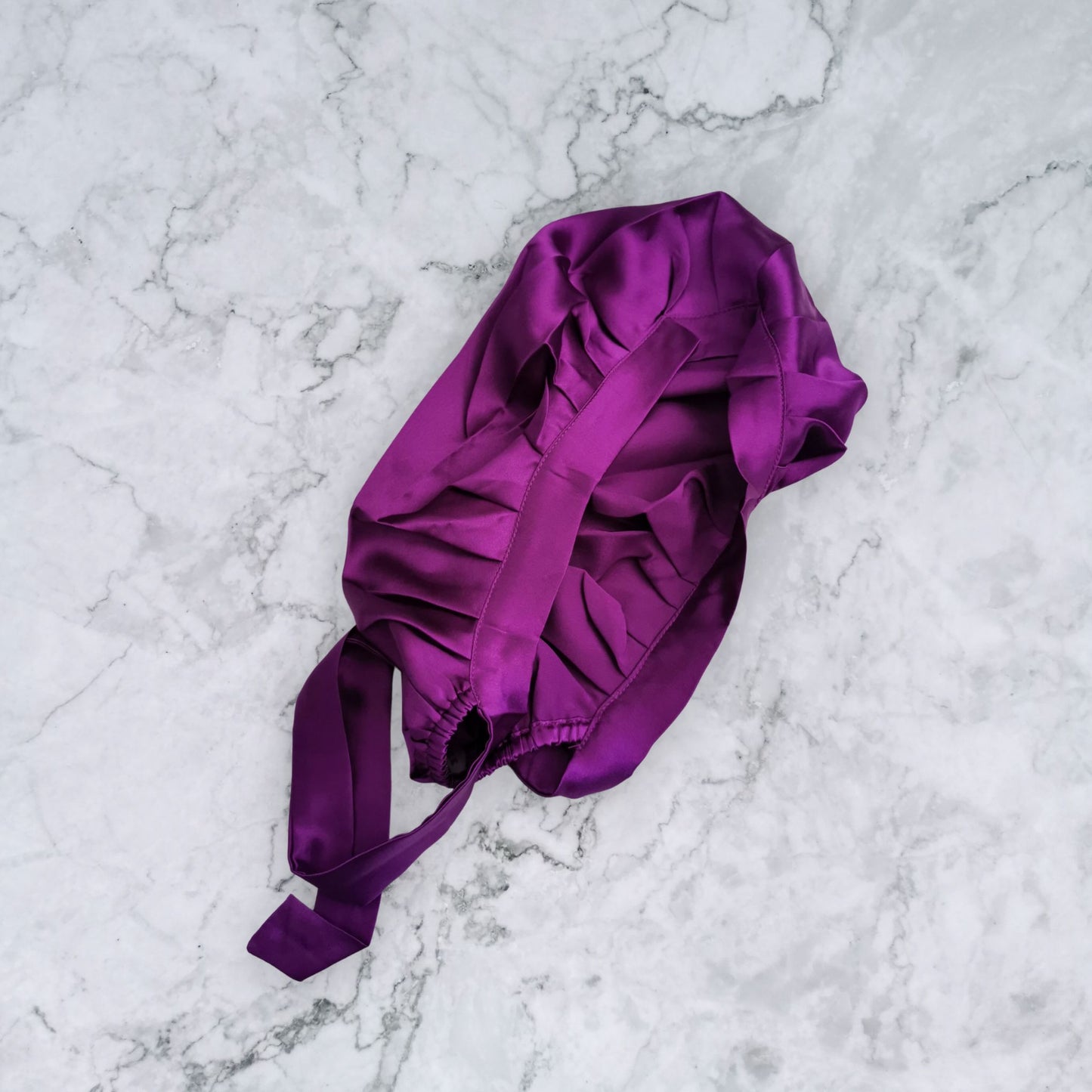 silk bonnet with hair wrap ties - purple closure view on marble background