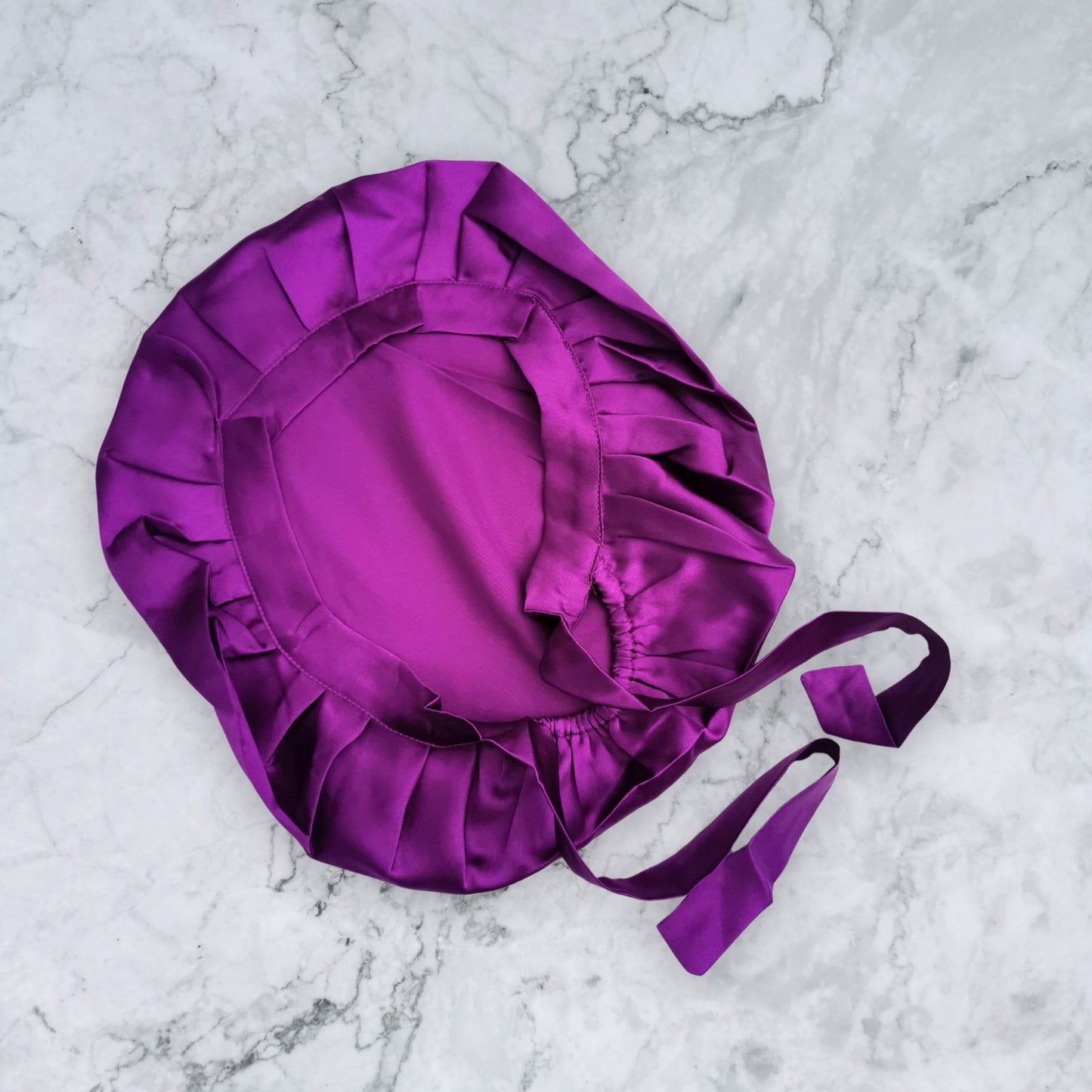 silk bonnet with hair wrap ties - purple flat view on marble background