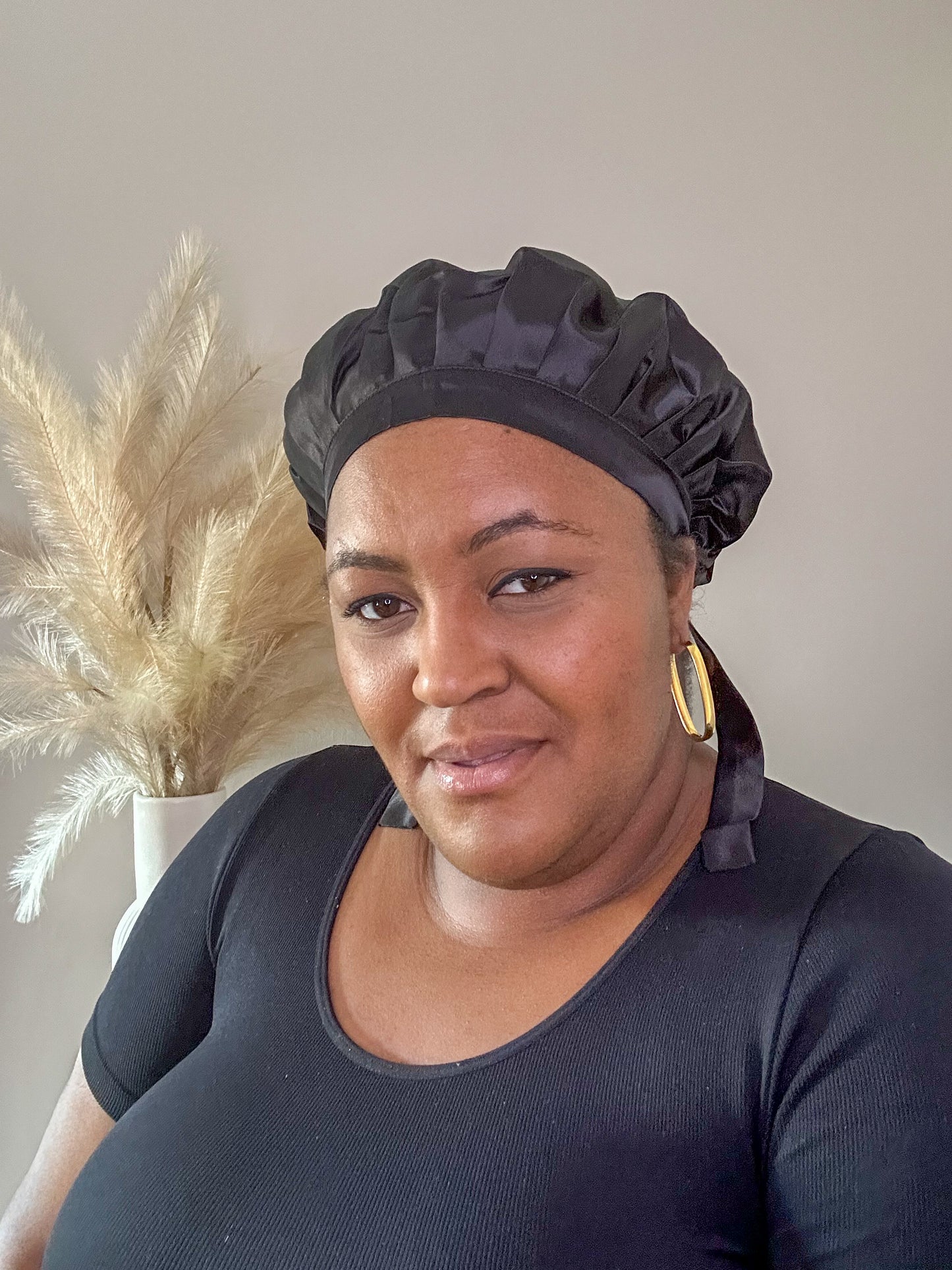 mulberry silk tie bonnet in black worn by black plus size model