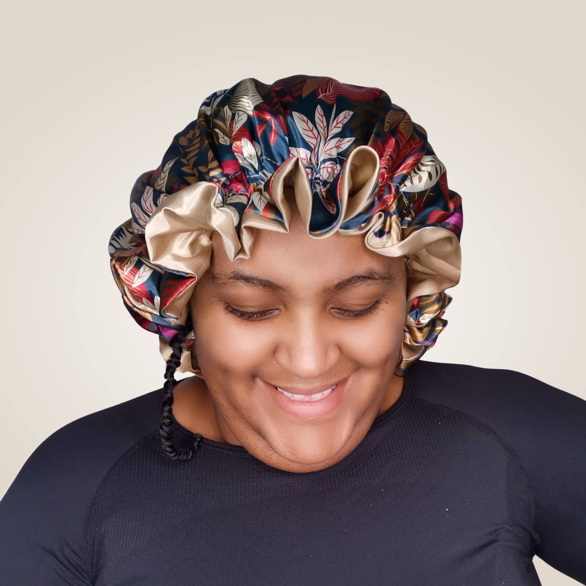 paradise print satin bonnet with leaves and frill finish - green with beige lining model view