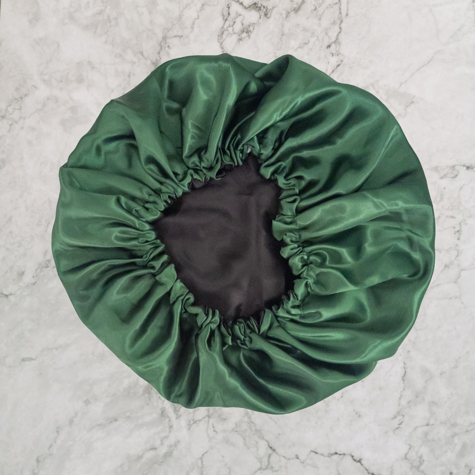 Hair Wrap Heaven vegan silk satin bonnet with adjustable elastic - bottle green with black lining