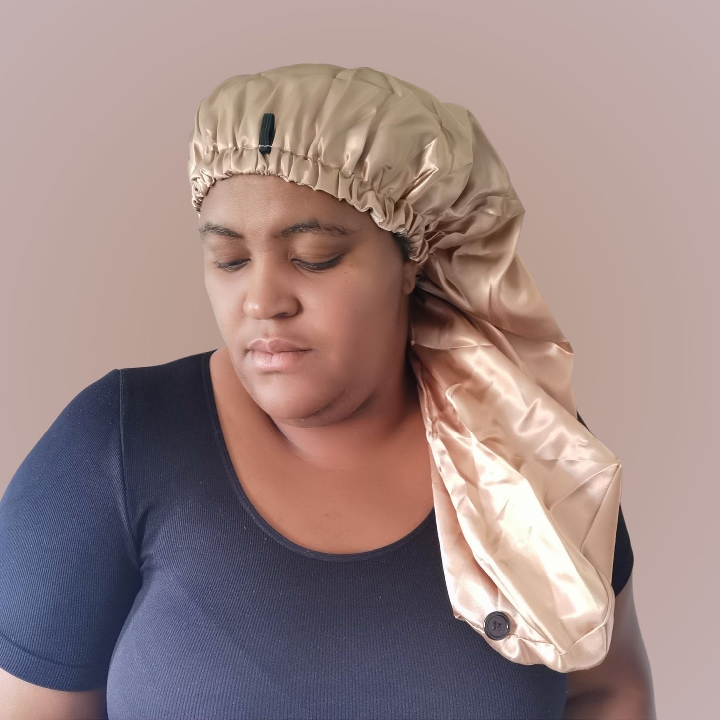 long satin bonnet in light gold with beige lining - model view