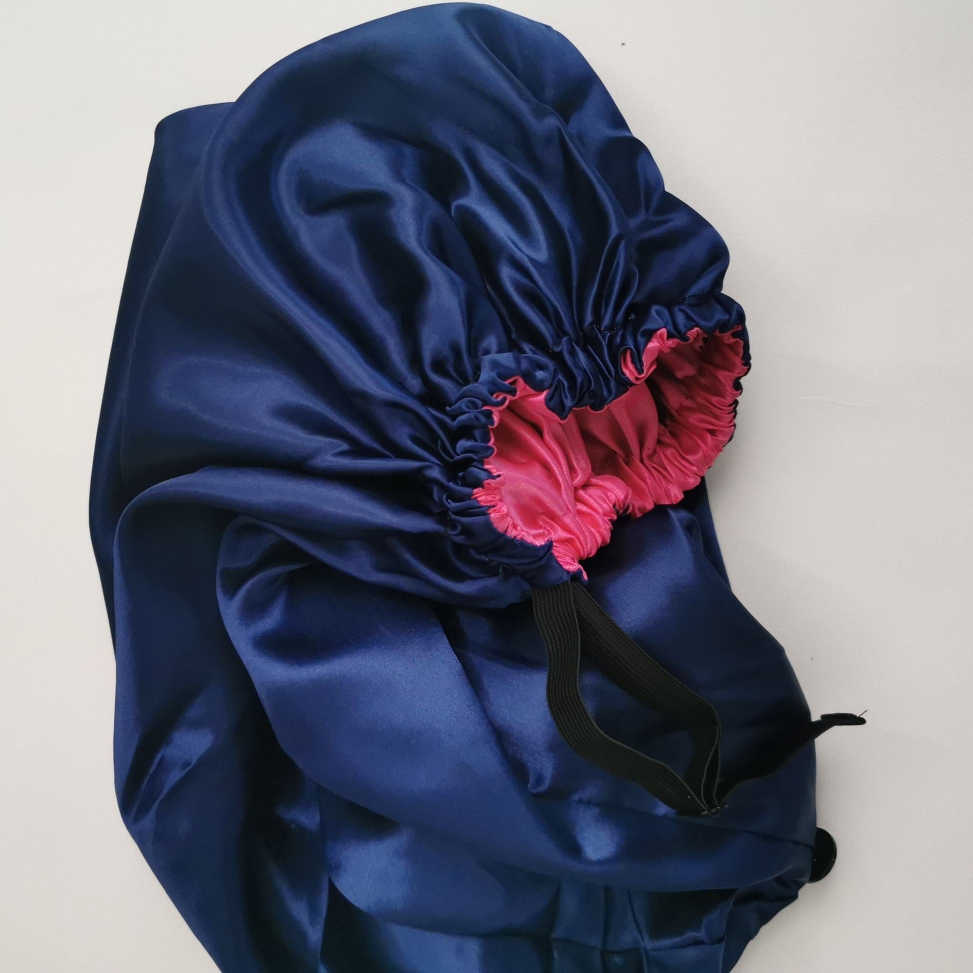 navy blue long satin bonnet with hot pink lining - elastic view