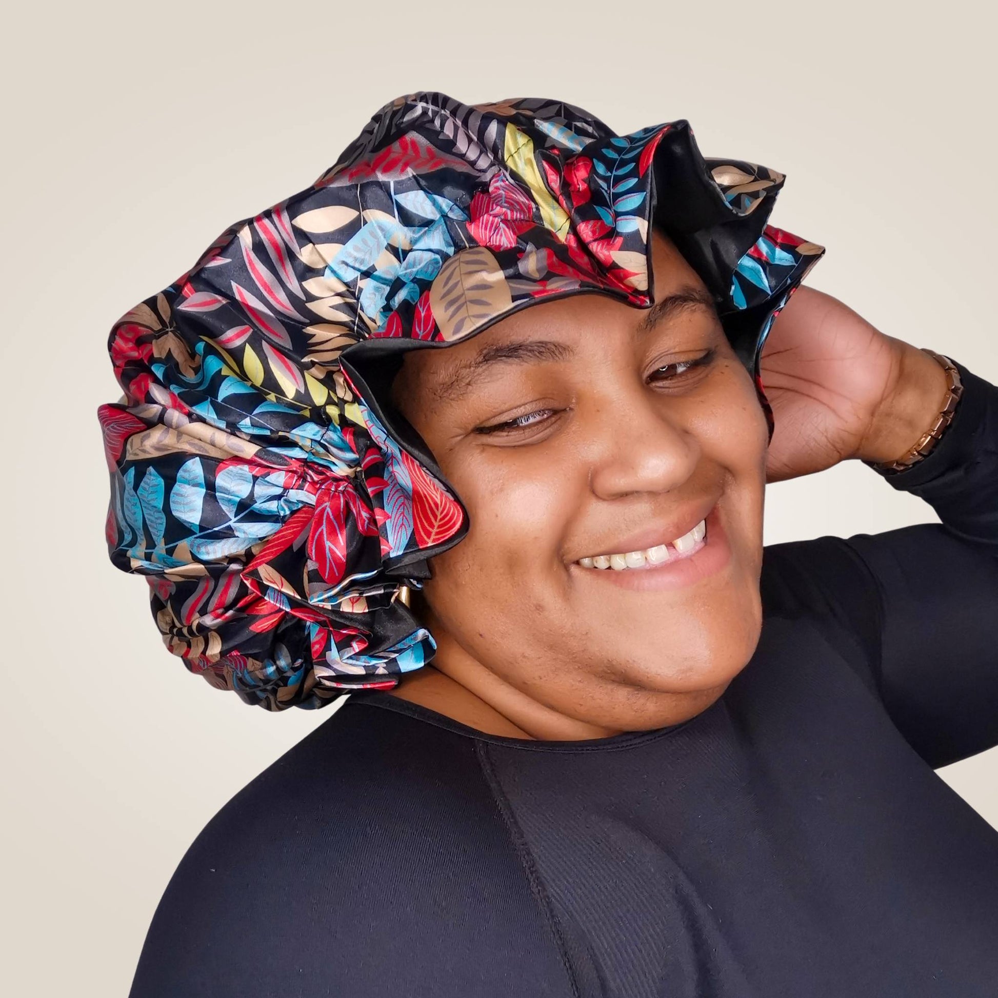 paradise print satin bonnet with leaves and frill finish - black with black lining model view