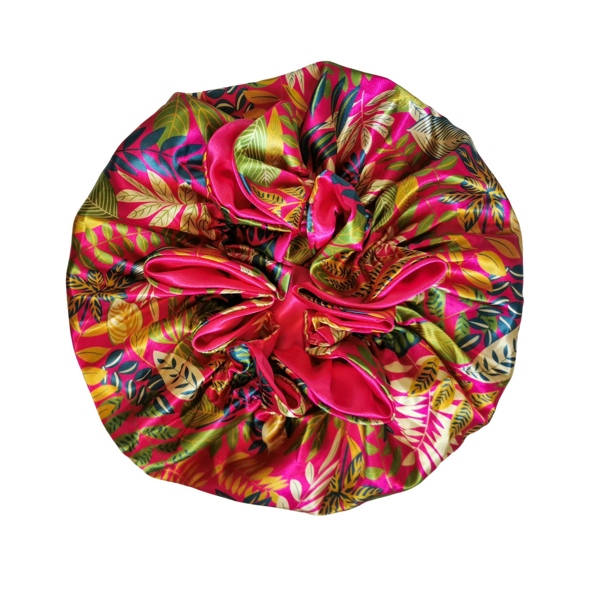 paradise print satin bonnet with leaves and flowers - pink with pink lining flat view