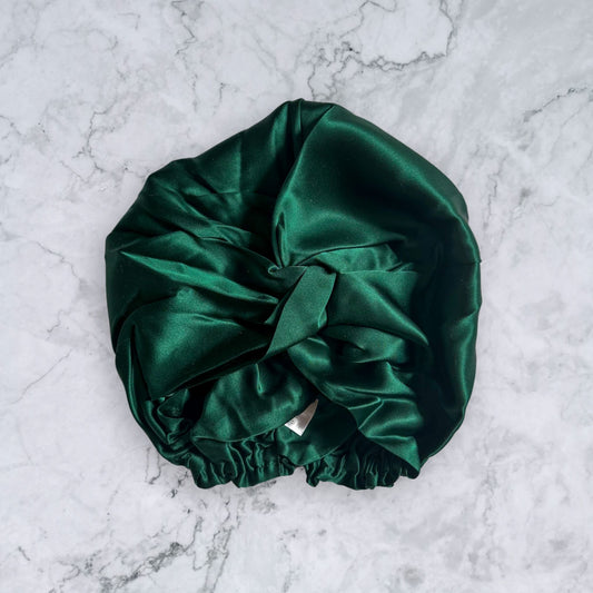 silk bonnet with twist detail to front elastic to back - dark green front view