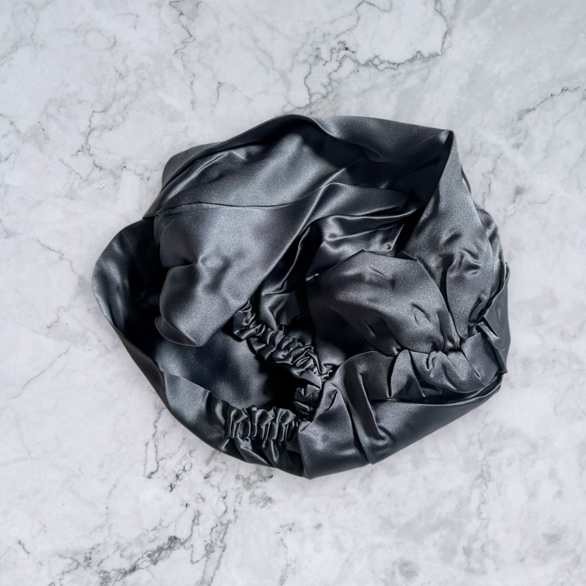 silk bonnet with twist detail to front elastic to back - charcoal grey back view