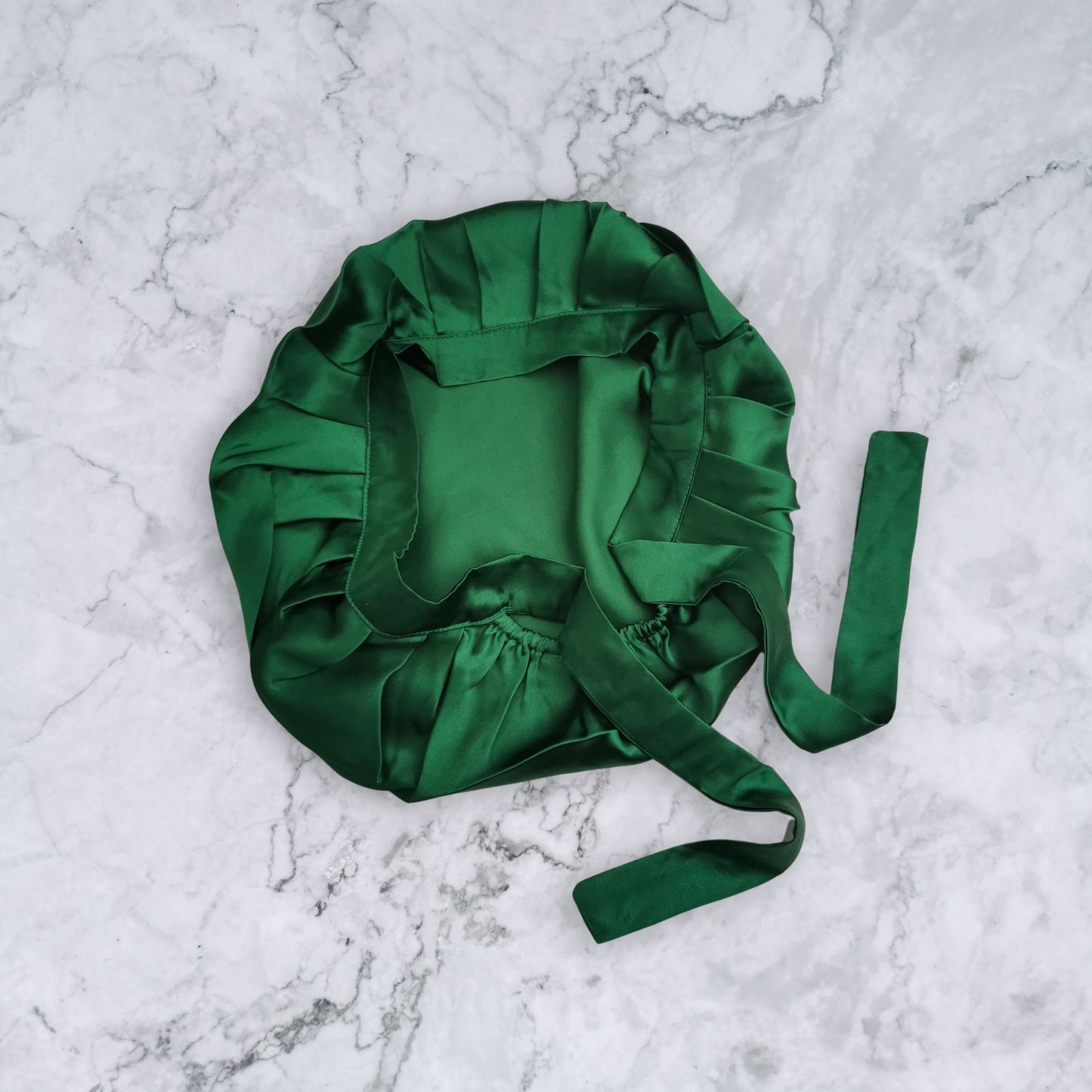 silk hair bonnet with ties in bottle green - flat view