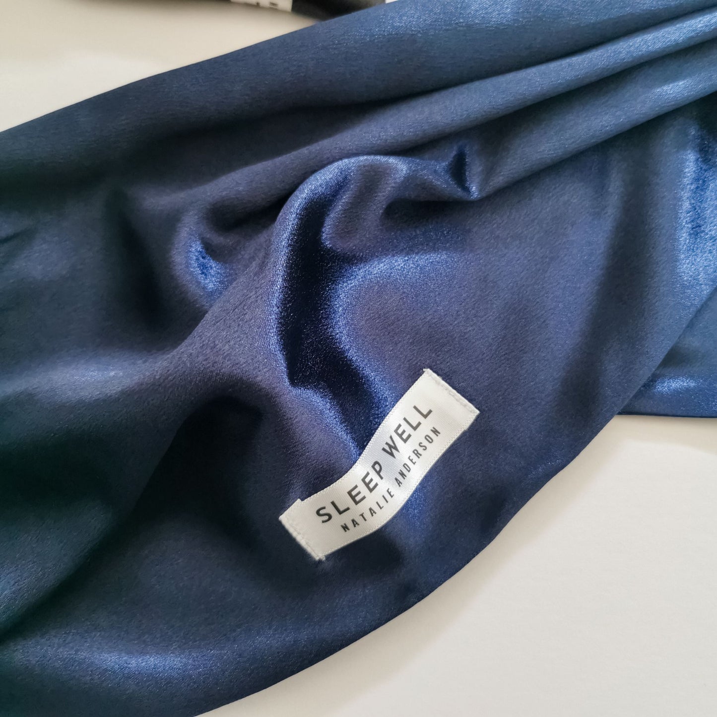 Satin sleep hair wrap in navy blue with sleep well label