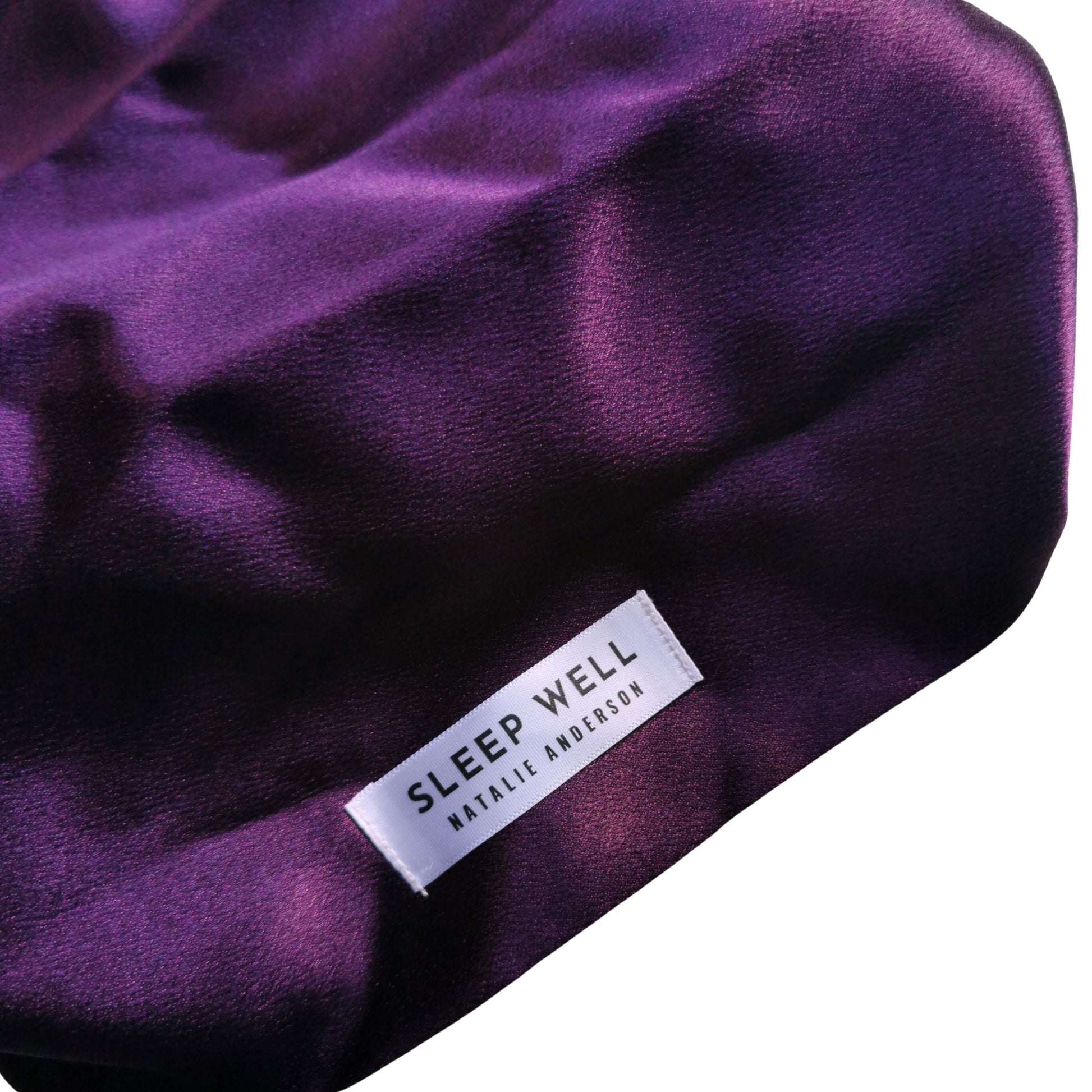Purple poly silk hair wrap with a 'Sleep Well Natalie Anderson' label on a white background