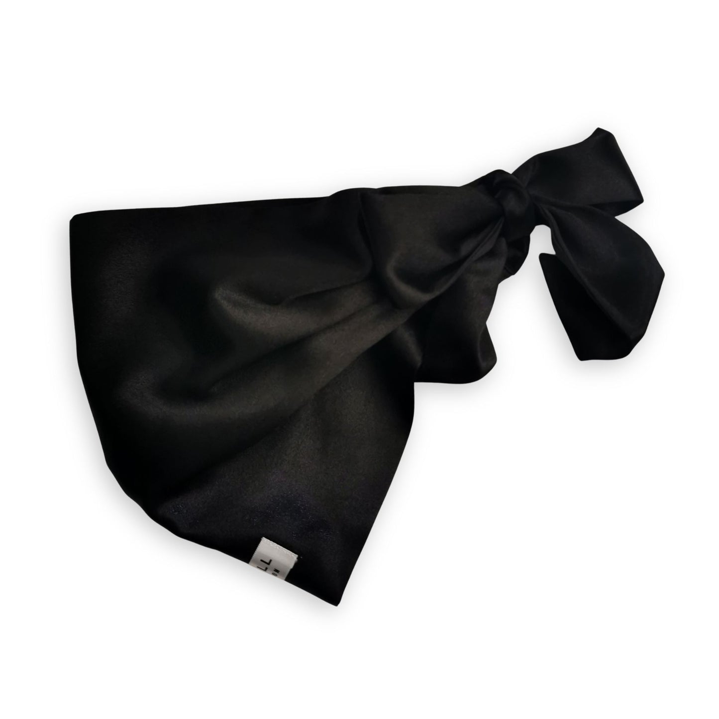 black satin hair wrap with ties to front and sleep well label