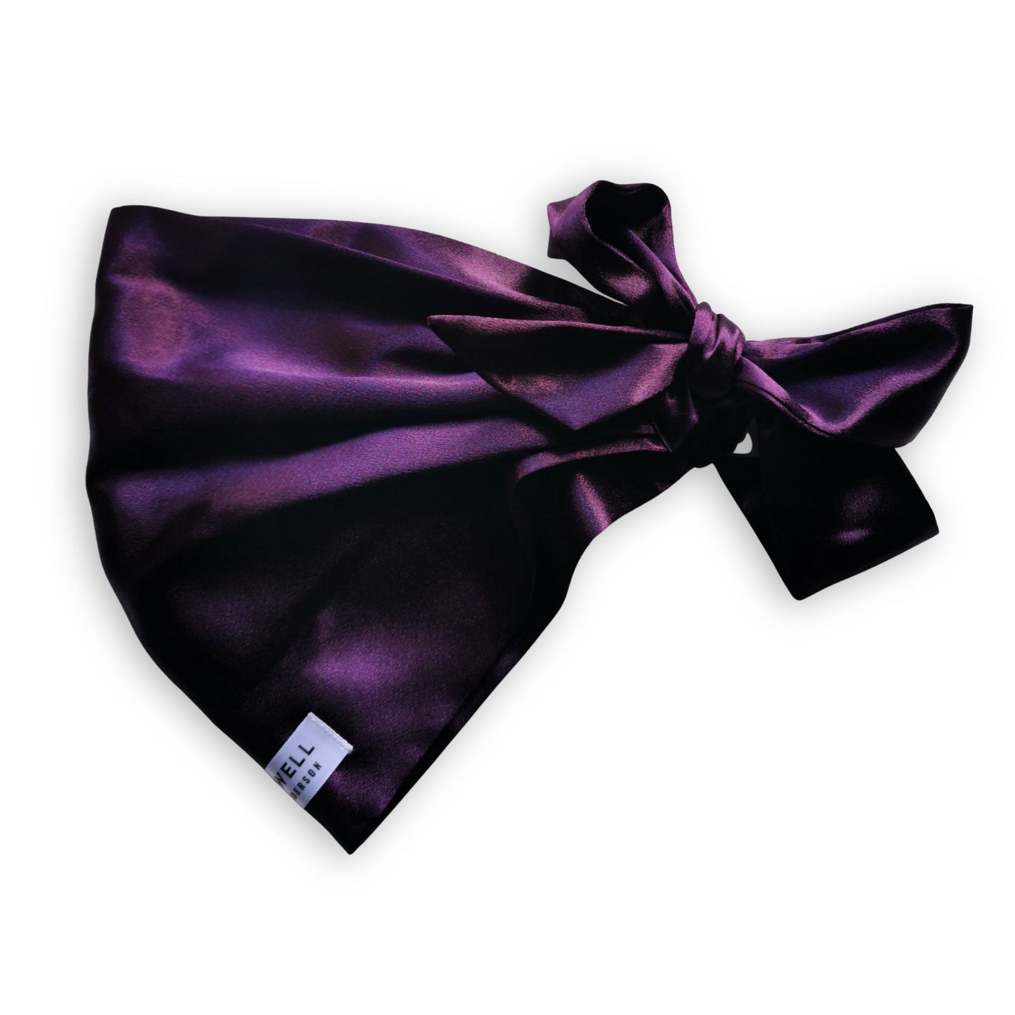 Purple satin hair scarf tied in a bow tie on a white background