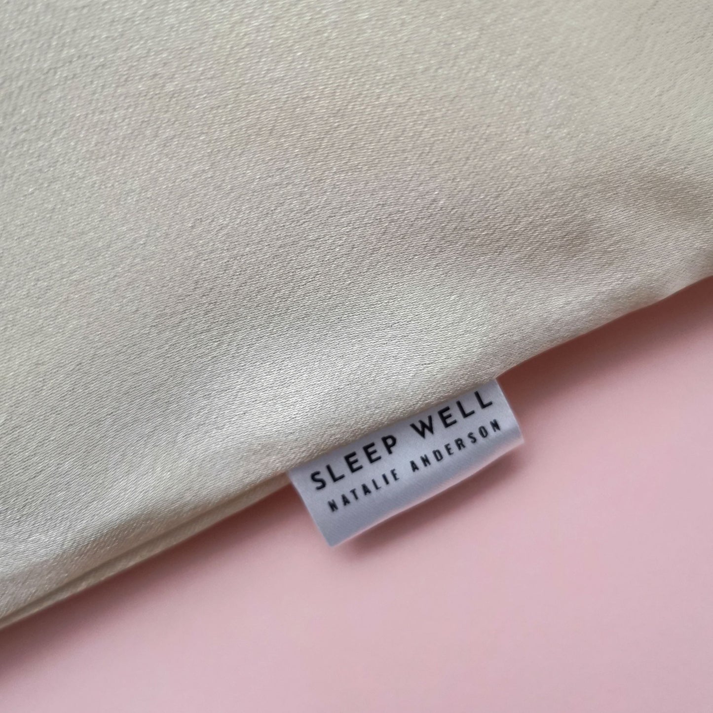 label view of SLEEP WELL champagne nude satin pillowcase